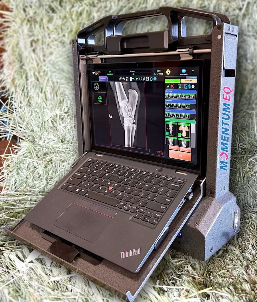 Momentum-EQ mobile equine digital radiography system open on stall bedding
