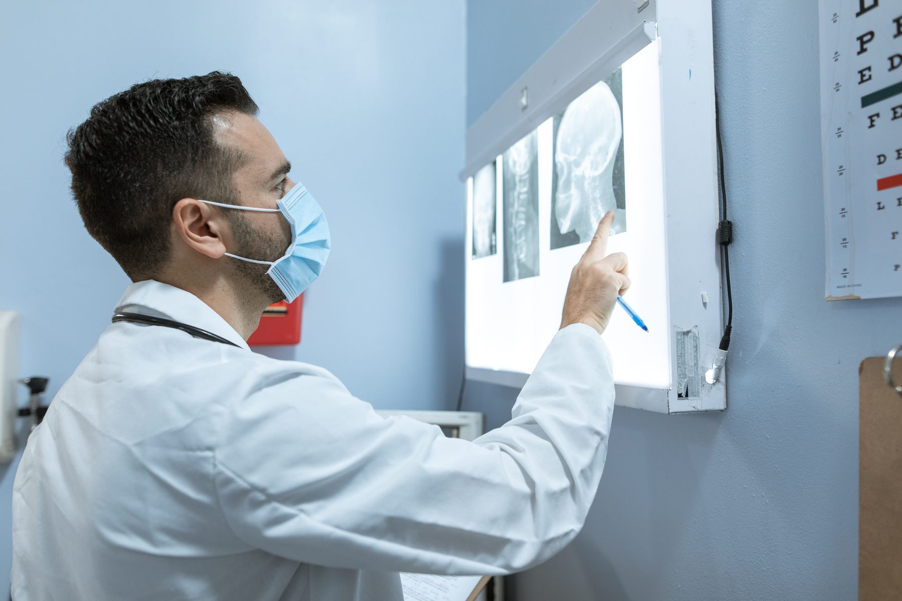 Clinician reviewing skull films on a lightbox
